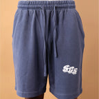 Blue shorts with a logo on a beige background