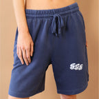 Navy blue shorts with a logo on a beige background